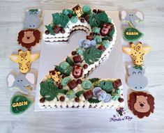 the number two is made out of cookies and decorated with animals