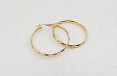 "14Kt real gold hoops earrings. Dainty 14kt hoop gold earrings. gold hammered huggies earrings. gift for her. 14kt texture elegant earrings Perfect hammered hoop for a different look. ♥ About The earrings: The hoops are made of 14k real gold. Wide 3.5 cm. (1.37\") Wide 3.4mm. Thickness 2mm. Shiny hammered finish. can be in yellow or white gold. Thank you for visiting my shop! Maya" Handmade 14k Yellow Gold Huggie Earrings, Handmade 14k Gold Hoop Earrings For Everyday, Handmade 14k Yellow Gold Hoop Earrings, Handmade 14k Gold Minimalist Huggie Earrings, Handmade 14k Gold Huggie Earrings For Everyday, Formal Small Hoop Hammered Earrings, Handmade 14k Gold Hoop Earrings For Anniversary, Handmade Minimalist 14k Gold Huggie Earrings, Minimalist Diamond Cut Hoop Earrings Gift