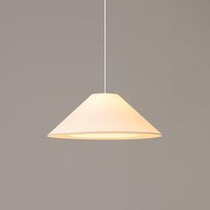 a white light hanging from a ceiling in a room