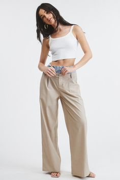 Introducing our one-of-a-kind Billie Trousers, where casual meets dressy in perfect harmony.These trouser pants are designed with a unique Peek-a-boo denim wash waistband that adds a playful twist to the sophisticated pinstripe pattern. Complete with functioning front pockets and belt loops on both the denim and pants, they seamlessly blend style and practicality. PRE ORDER APRIL 26TH Fabric & fit: SELF: 69% POLYESTER 29% RAYON 2% SPANDEXCONTRAST: 100% COTTONModel is wearing size Small. Mid-rise Wide Leg Pants For Summer, Versatile Cotton Jeans For Day Out, Chic Non-stretch Everyday Pants, Mid-rise Wide Leg Pants For Spring Day Out, Spring Tapered Leg Jeans With Elastic Waistband, High Rise Wide Leg Pants For Summer Everyday Wear, High Rise Wide Leg Pants For Summer, Trendy Mid-rise Wide Leg Pants For Everyday, Summer High Rise Wide Leg Pants For Everyday