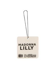 a white tag with the words madonna lilly on it hanging from a black string, against a white background