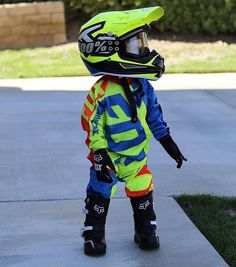 a young child wearing a helmet and safety gear with the words my future son on it