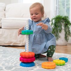 a toddler playing with toys on the floor