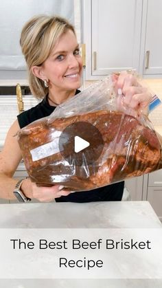 a woman holding a bag of meat in her hands