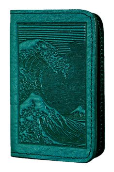 a green leather wallet with an image of the great wave on it