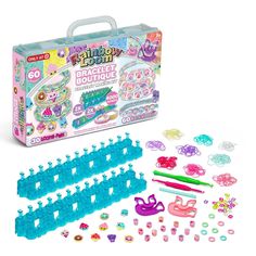 this is an image of a plastic craft kit with lots of items in it, including scissors and beads