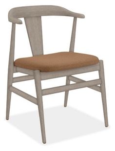 a white chair with a brown seat cushion