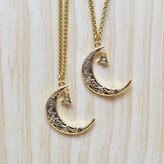 Looking for a celestial necklace with lots of magic and luck? This necklace is it! This necklace is made from a crescent moon charm. The moon charm has three stars with clear cz centers on the front. On the front of the moon the words; magic, luck and love can be seen along with a peace sign and an evil eye. A star drop hangs from the moon. The star like the others has a clear cz crystal in the center. The pendant is gold plated and has a shiny surface. The necklace is finished off with a stainl Magical Sun And Moon Design Necklace Gift, Crescent Moon Charm Necklace, Magical Moon Phase Jewelry, Celestial Moon Charm Necklace For Jewelry Making, Magical Moon Phase Necklace With Round Pendant, Spiritual Crescent Moon Charm Necklaces, Magical Moon Phase Pendant Necklace, Spiritual Crescent Moon Charm Necklace, Celestial Moon Charms Necklace