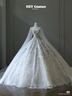 a white wedding dress on display with the words hey couture written above it