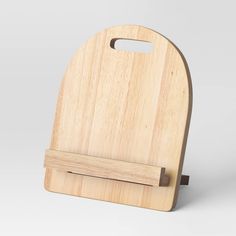 a wooden cutting board with a knife holder on the front and back side, made out of wood