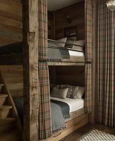 the bunk beds are made out of wood and have plaid sheets on them, but no mattresses