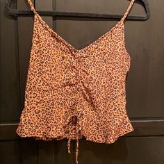 3 For &12! Cute Tank With Adjustable Straps And Ties In The Front. Ruffle Around. Brown With Black Spots. 100% Viscose. Seems Unused Without Tags. Pit To Pit Is 15” Shortest Length Is 16” Longest Length 20” Stretch Leopard Print Tops For The Beach, Casual Tiger Print Tops For Spring, Brown Tiger Print Tops For Spring, Stretch Tiger Print Top For Summer, Brown Tiger Print Top For Spring, Casual Stretch Tiger Print Tops, Casual Fitted Top With Tiger Print, Leopard Print Spaghetti Strap Summer Top, Spring Brown Tiger Print Tops