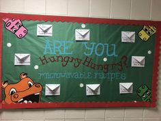 a bulletin board that says are you hogging? and is decorated with envelopes