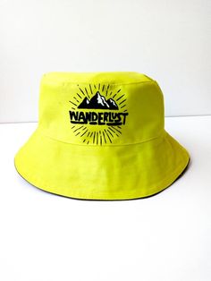 Wanderlust Bucket Hat, Neon green Bucket Hat, Handmade, Handpainted Fashionable and comfortable bucket hat head accessory. Perfect for covering the face and eyes from sun All hats are painted by hand so there might be some ever-so-slight differences (maybe a thicker/thinner brush stroke in some spots) No screen printing or vinyl transfers, it's all made from the heart baby :) IMPORTANT CARE INSTRUCTIONS: Hand wash, Spot clean, Air dry only, Do not bleach! Spot wash using a bleach-free, environme Casual Green Bucket Hat For Outdoor Activities, Fun Bucket Hat For Outdoors, Fun Bucket Hat For Outdoor, Fun Wide Brim Bucket Hat For Outdoor, Green Bucket Hat For Outdoor Activities, Green Bucket Hat With Short Brim For Vacation, Green Bucket Sun Hat For Outdoor Activities, Green Summer Bucket Hat For Outdoor, Fun Outdoor Bucket Hat With Short Brim