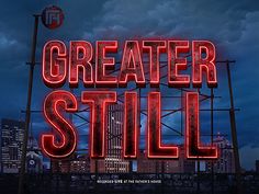 a neon sign that says greater still in front of a cityscape at night