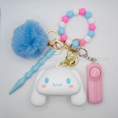 an assortment of items are displayed on a white surface with a blue pom - pom