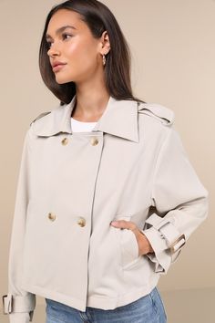 Stay cute in the coolest weather with the Lulus Stylish Weather Beige Collared Cropped Trench Coat! Lightweight woven twill shapes long sleeves with adjustable, belted cuffs and a collared neckline with decorative straps at the shoulders. Boxy bodice has a trench coat-style design, with a double-breasted effect at the front and front welt pockets. Adjustable cinches at the sizes complete the look. Fit: This garment fits true to size. Length: Size medium measures 22.5" from shoulder to hem. Bust: Spring Double-breasted Outerwear With Belted Cuffs, Fall Long Coat With Belted Cuffs, Trendy Winter Outerwear With Belted Cuffs, Oversized Beige Outerwear With Belted Cuffs, Chic Button-up Outerwear With Belted Cuffs, Trendy Double-breasted Outerwear With Belted Cuffs, Trendy Long Coat With Belted Cuffs, Trendy Belted Long Coat, Spring Collared Outerwear With Belted Cuffs