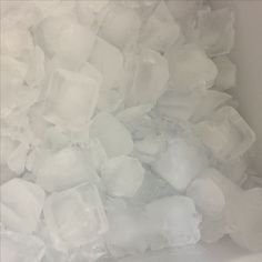 ice cubes are piled up in a bowl