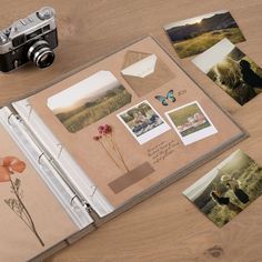 an open photo album with pictures, photos and a camera sitting on top of it