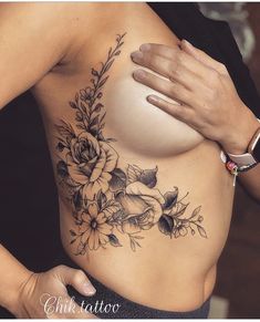 a woman's breast with flowers on it