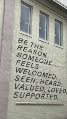 a sign on the side of a building that says be the reason someone feels welcome