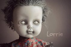 a creepy doll with hair on it's head and the words lorie above it