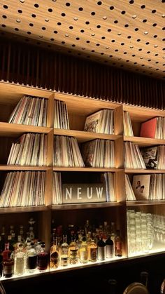 the shelves are filled with records and cds