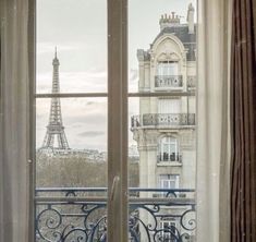 an open window overlooking the eiffel tower in paris