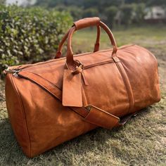 Leather Duffle Bag Features body { font-family: Arial, sans-serif; color: #333; line-height: 1.6; } h2 { color: #000; } Carry all your essentials in style with our genuine leather bag. Enjoy free shipping on all cowhide travel bags. 24"L x 11.8"W x 12.5"H (61cm x 30cm x 32cm) Made of high-quality, full-grain genuine cowhide leather with a rich texture and durable finish. Separate shoe compartment for organized packing and easy access. Main Compartment Spacious main compartment to fit all travel essentials including clothes, shoes, laptop, iPad, toiletry bags, files, and documents. Interior Features Inside laptop pocket 1 long zip pocket Multiple compartments for phone, wallet, and accessories Perfect for weekend getaways with a dedicated shoe compartment. Exterior Features Outside zip pock Weekender Bag Men, Mens Weekend Bag, Leather Weekender Bag, Leather Toiletry Bag, Leather Waist Bag, Real Leather Bags, Leather Duffel, Leather Weekender, Cowhide Bag