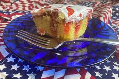 a piece of cake sitting on top of a blue plate with a fork next to it