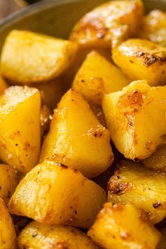 cooked potatoes in a pan with seasoning on top