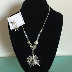 This Women's Starfish Necklace And Erring Set. The Necklace Is Sterling Silver And Has A Starfish Along With Turquoise Beads And Small Shellfish On The Chain. The Earrings Are Small Sterling Starfish With Hook Backs. The Set Is New With Tags. Ocean-inspired Starfish Dangle Jewelry, Metal Starfish Jewelry, Nickel Free Starfish Jewelry In Ocean-inspired Style, Nickel-free Starfish Jewelry With Ocean-inspired Style, Nickel-free Starfish Shaped Ocean-inspired Jewelry, Nickel-free Star-shaped Ocean-inspired Jewelry, Metal Starfish Charm Jewelry, Ocean-inspired Starfish Nickel-free Jewelry, Elegant Nickel-free Starfish Jewelry