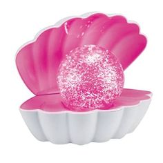 a pink and white bowl with a ball in the center on it's side