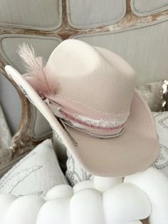 Women's cowboy hat  Boots not included  Decorative 100% polyester cowboy hat.  Geo quarts charm attached One size fits most  56-58  Adorable   All sales final. Birthday girl, bride to be, bachelorette fun.  Need a different color ? Message me. Ivory hat, pinks, whites and creams silver stars under brim Custom Cowgirl Hat Ideas, Boho Cowboy Hat, Western Mini Hat For Kentucky Derby, Western Style Mini Hats For Kentucky Derby, Country Style Mini Hats For Kentucky Derby And Rodeo, Western Wide Brim Mini Hats For Country Events, Country Style Mini Hats For Kentucky Derby, Western Style Pink Felt Hat For Spring, Western Style Mini Hat For Festivals