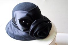 1980 Vintage , Black Felt Wool , Evening/ Formal/ Church Hat With Black Satin Rose on the Front. by Mr. Hi's Classic in USA. - Etsy Elegant Winter Formal Cloche Hat, Elegant Curved Brim Felt Hat For Evening, Elegant Felt Hat For Evening In Winter, Elegant Black Felt Hat For Kentucky Derby, Elegant Evening Felt Hat With Curved Brim, Elegant Black Felt Hat For Formal Occasions, Chic Black Felt Hat For Evening, Elegant Wide Brim Felt Hat For Evening, Elegant Black Felt Hat For Evening