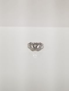 "Thanks for shopping our vintage estate store. We tend to sell well below wholesale and truly hope you enjoy all of our items. Many of the items are one of a kind, so please enjoy scrolling through the pictures and hopefully something will catch your eye. Black spots are from camera. Estate 10k white gold heart to heart .01ct diamond ring. There is one small diamond in the center of the setting, the rest are diamond accents. Ring size: 5.25 Setting: 3/8\" by 1/2\" Band width: 1.5mm Weight: 1.70 grams Beautiful ring one that you will love, marked 10k." Libra Pendant, Heart Vintage, Heart To Heart, Ring Heart, Black Spot, Vintage Ring, Ring Band, Gold Heart, Eye Black