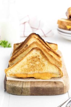 a grilled cheese sandwich on a cutting board