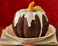 a chocolate bundt cake with icing drizzled on top