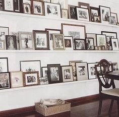 there are many pictures on the wall with frames