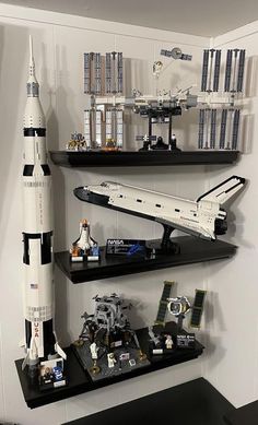 a space shuttle is on display in a room with bookshelves and legos