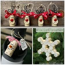 wine cork ornaments with red bows on them and snowmen hanging from the bottle top