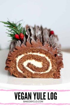 vegan yule log cake on a white plate