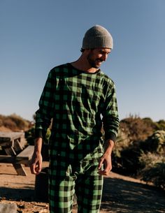 Having a stylish and cozy pair of sleepwear has never been easier with the Men’s Black & Green Plaid Cotton Pajamas. This comfy two-piece set is not only imported but will easily match with other similar family sets for some festive fun. The set consists of a long-sleeved shirt and pants, both with a black and green plaid pattern. Every product is made of 100% soft cotton and offers sizes from Small to 6XL. Pajamas also have ribbed cuffs at the ankles and wrists for extra comfort, along with an Matching Prints, Red Buffalo Plaid, Cotton Pajamas, Night Wear, Family Set, Mens Plaid, Plaid Fashion, Cotton Pyjamas, Slim Pants