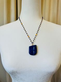 A gorgeous piece of asymetrical Lapis Lazuli on a lapis faceted, gold filled bead chain.  The crystal is hand-drilled and secured with resin for durability. The lapis is 1.5 inches long by 1.25 inches wide and the chain is 20 inches end to end with a 2 inch extender. 💙Metaphysical Properties: A stone of wisdom, intuition, and truth. Lapis Lazuli is known as a powerful crystal for anyone seeking to deepen their connection to self. Lapis Lazuli are known for opening the third eye chakra, the center of intuition and inner wisdom. By enhancing your ability to turn inward and uncover your truth, the energy of the Lapis Lazuli crystal  can support anyone ready to step into their power and authentic self.  This stone was used throughout the Hathor temples in ancient Egypt 💙 **All crystals are h Lapis Lazuli Beaded Necklace With Faceted Beads For Gift, Spiritual Lapis Lazuli Necklace With Faceted Beads, Gold Lapis Lazuli Faceted Beads Necklace, Sapphire Beaded Necklaces With Natural Lapis Lazuli Stones, Gold Lapis Lazuli Necklace With Faceted Beads, Lapis Lazuli Jewelry With Faceted Beads, Healing Lapis Lazuli Jewelry With Faceted Beads, Spiritual Lapis Lazuli Jewelry With Faceted Beads, Lapis Lazuli Faceted Beads Jewelry For Gift