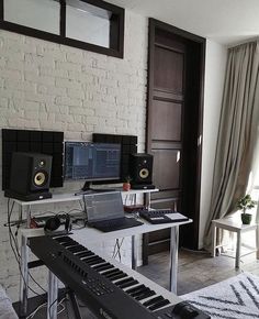 a living room filled with furniture and musical equipment