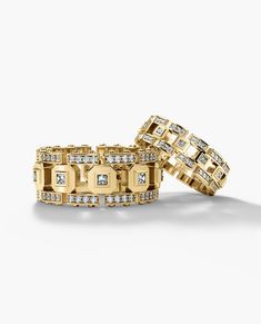 two gold bracelets with diamonds on them