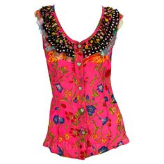 Presenting a pink floral Gianni Versace sleeveless top, designed by Gianni Versace. From the Spring/Summer 1993 collection, this top debuted on the season's runway on Emma Wiklund. This girly top features a scoop neckline accented with layers of chiffon ruffles and is made complete with Versace Medusa relief buttons. Approximate measurements: Size - 40IT/6US Shoulder to hem: 24.5" Bust: 34 - 38" Waist: 30" Summer Sleeveless Pink Blouse, Pink Sleeveless Summer Blouse, Pink Floral Print Tank Top For Spring, Sleeveless Pink Blouse For Spring, Pink Feminine Sleeveless Blouse, Pink Floral Print Tank Top For Summer, Pink Floral Print Sleeveless Blouse, Pink Sleeveless Blouse For Beach, Sleeveless Pink Ruffle Top