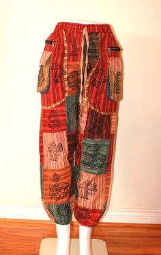 Bohemian style pants made proudly with hand in Nepal 100% cotton fits from small to xl . Measurements Waist:  Length: Leg Width (Thigh) : Bohemian Cotton Bottoms With Patchwork, Bohemian Patchwork Harem Pants, Bohemian Baggy Patchwork Harem Pants, Cotton Patchwork Pants, Cotton Patchwork Trousers, Hippie Style Patchwork Cotton Bottoms, Hippie Style Cotton Bottoms With Patchwork, Hippie Cotton Patchwork Bottoms, Festival Cotton Pants With Pockets