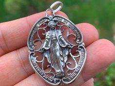 Silver Miraculous Medal Jewelry As Gift, Commemorative Silver Jewelry With Miraculous Medal, Oval Miraculous Medal Spiritual Jewelry, Silver Miraculous Medal Memorial Jewelry, Spiritual Silver Jewelry With Virgin Mary, Old Objects, Silver Spiritual Virgin Mary Jewelry, Silver Miraculous Medal Necklace For Commemoration, Silver Virgin Mary Pendant Jewelry