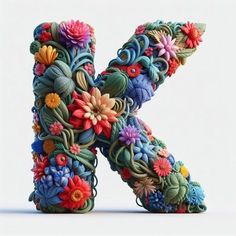 the letter k is made up of colorful flowers